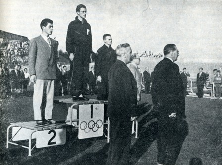 Russell Mockridge on Victor's dais after 100m Time Trial Helsinki Olympic Games, 1952.
